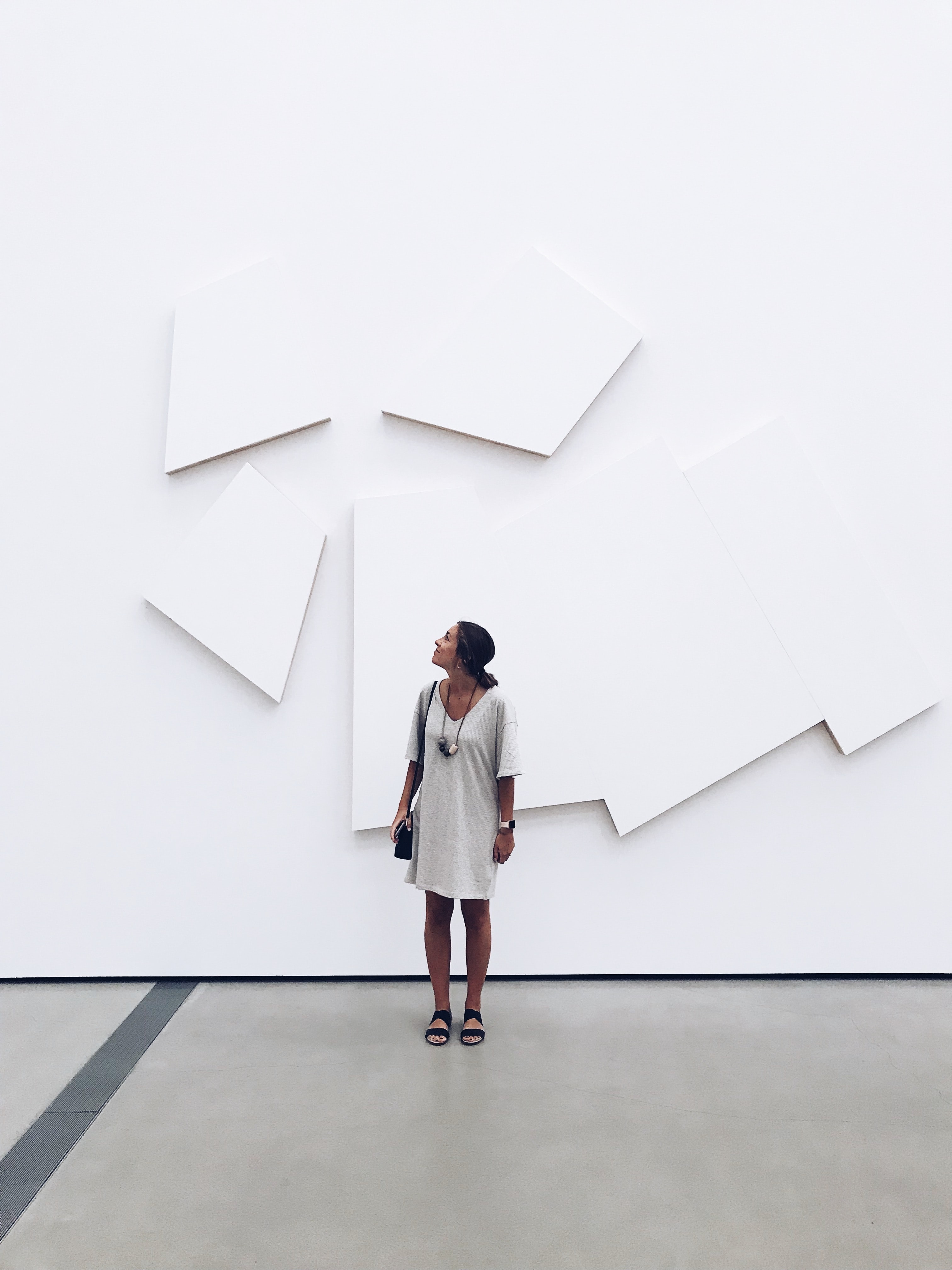 woman standing inside a museum